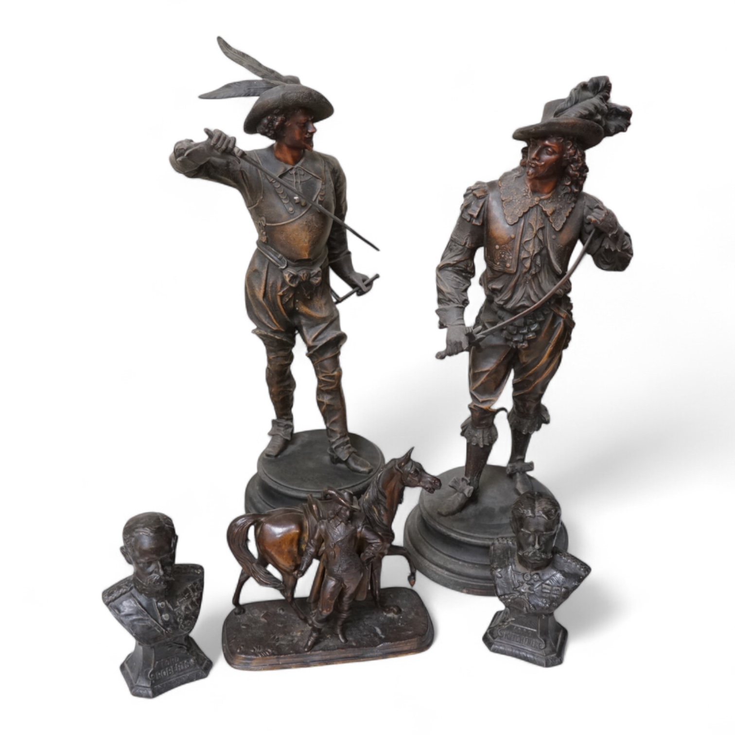 A pair of bronzed spelter figures, another pair of busts and a bronzed spelter group of a Cavalier and his horse, tallest 52cm